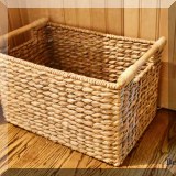 D081. Storage basket with wooden handles.  